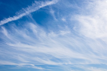 Cirrostratus clouds on a blue sky on a sunny dayの写真素材