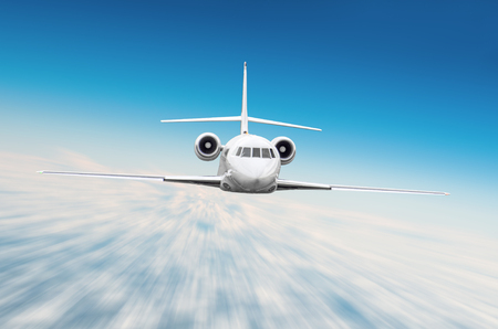 Small passenger airplane flies at high speed in the skyの写真素材