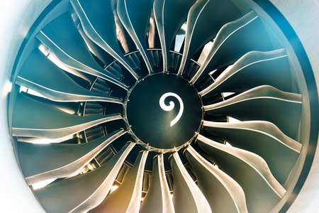 Close up of turbojet of aircraft turbine engine fan civil with a gradient of colors from cold to warmの写真素材