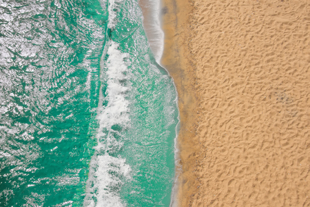 Aerial view of young woman swimming on the pink swim ring in the transparent turquoise sea in Oludeniz,Turkey. Summer seascape with girl, beautiful waves, azure water in sunny day. Top view from droneの写真素材