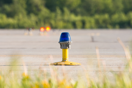 Ground side lamp taxiway at the airportの写真素材