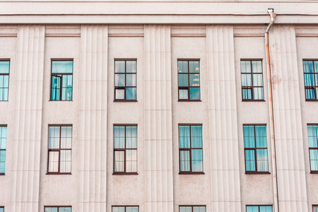 The facade of the historic building pastel colors building with windowの写真素材