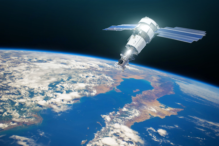 Research, probing, monitoring of in atmosphere. Communications satellite in orbit above the surface of the planet Earth.の写真素材