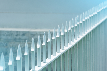 The sharp tip of the metal fence of the fence rowの写真素材