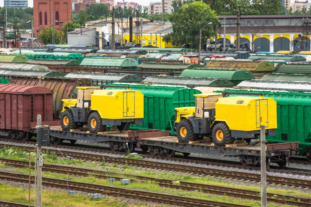 Sorting freight railway station in the city wagons for trains, with tractors and machinesの写真素材