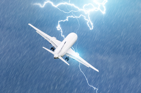 Lightning strike on an airplane electric discharge during a thunderstorm on takeoff at the airportの写真素材