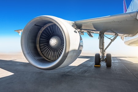 Wing jet engine of the airplane at the airport apronの写真素材