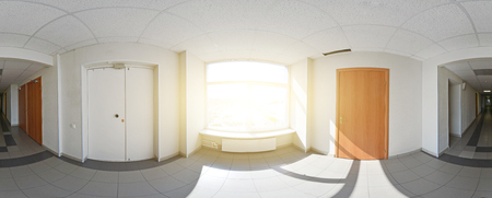 Spherical 360 degrees panorama projection, interior empty long corridor with doors and entrances to different roomの写真素材