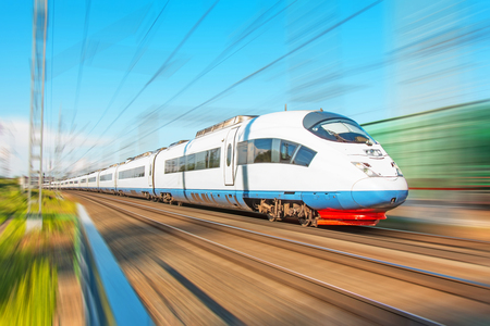 High speed train rides at high speed at the railway station in the cityの写真素材