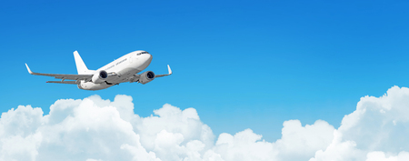Passenger aircraft cloudscape with white airplane is flying in the daytime sky cumulus clouds, panorama viewの写真素材