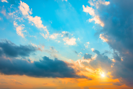 Beautiful sunset on the dramatic sky of different colors after the summer rain and the bright sunの写真素材