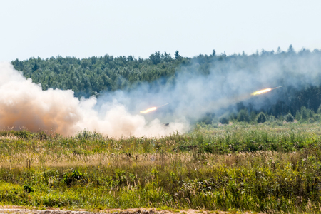 Launching military rockets in the woodlands, war shot defense attackの写真素材