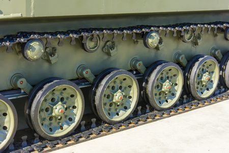 Caterpillar wheels of a tank of green colour close-upの写真素材