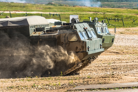 The front of the tank, riding through the dustの写真素材