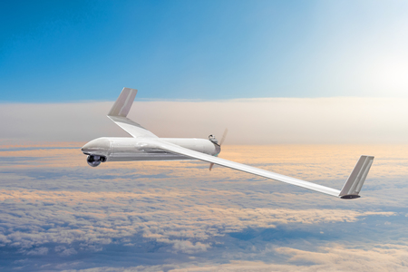Unmanned military drone on patrol air territory at high altitudeの写真素材