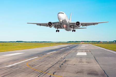 Airplane aircraft flying departure after flight, landing on a runway in the good weather clear sky dayの写真素材