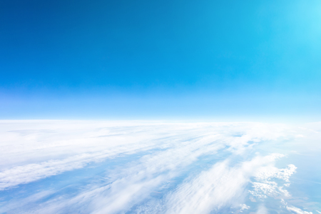 Panorama sky from altitude in the cumulus and layered stratus cloudsの写真素材