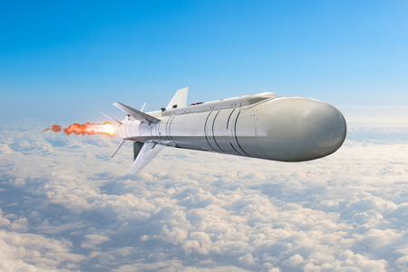 Rocket launch with fire clouds, large rocket with fire and engines flying in the sky aimed at the targetの写真素材