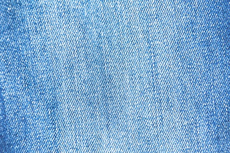 Texture of jeans blue with white splashes, cloth backgroundの写真素材