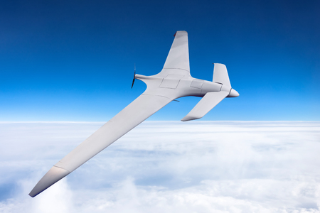 Unmanned military drone high speed flight in the skyの写真素材