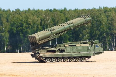 Powerful carrier rocket vehicle with a rocket aimed into the skyの写真素材