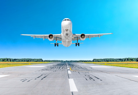Airplane aircraft flying departure after flight, landing on a runway in the good weather clear sky dayの写真素材