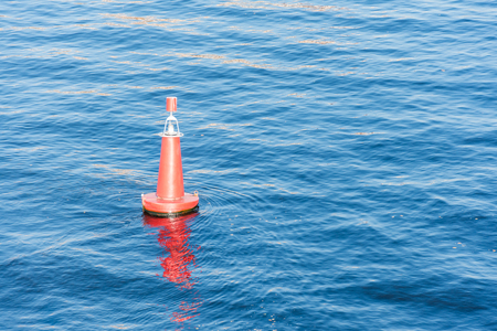 Buoy in the water on the bay, top view with empty spaceの写真素材
