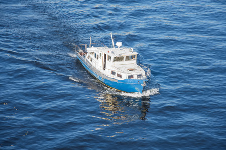 Boat sailing in the northern seas of the coastal zoneの写真素材