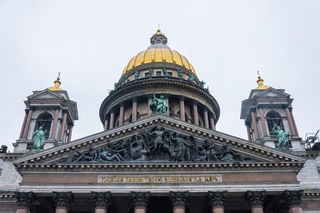 The dome of St. Isaac's Cathedral over other historical buildings in the city of St. Petersburgの写真素材