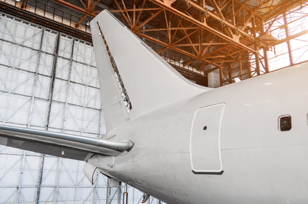 The tail of the airplanein the hangar, the concept repair aircraft maintenanceの写真素材