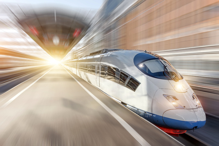 High speed train rides at the railway station in the cityの写真素材