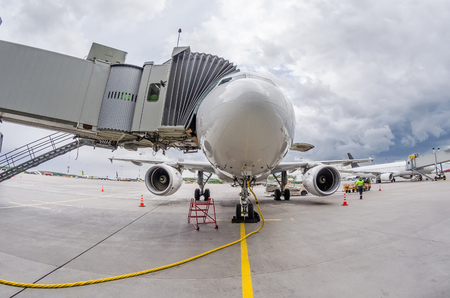 Airplane at the ramp airport terminal, wide viewing angleの写真素材