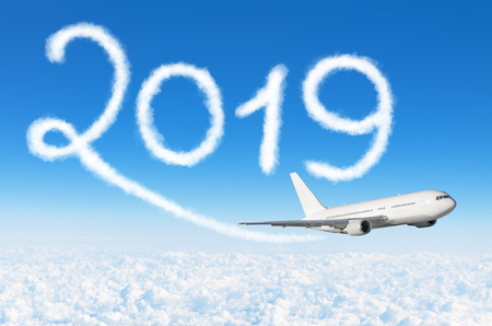 Happy New year 2019 concept travel. Drawing by passenger airplane vapor contrail in skyの写真素材