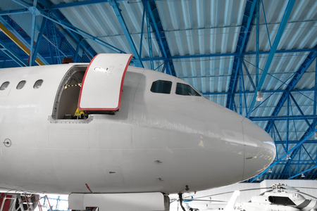 The nose of the aircraft cockpit in the maintenance hangarの写真素材