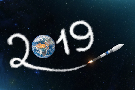 Space shuttle rocket in leaves a trail 2019 to the planet Earth. The concept of a scientific New Year in the World - Asia, Europe, Africa.の写真素材