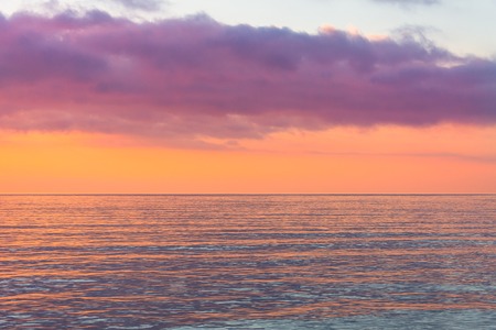 Red shades landscape sky and sea at sunset.の写真素材