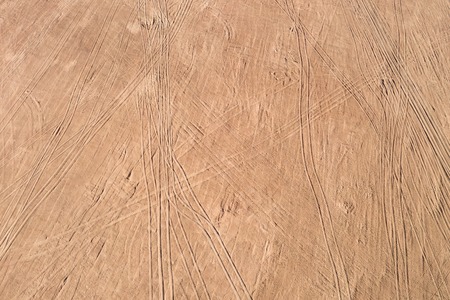 View on the sand with traces of cars and traces of people, aerial viewの写真素材