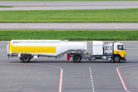 Tanker rides on the steering track on the airport's airfieldの写真素材