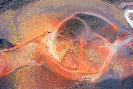 Old extinct inactive craters on the slope of the volcano Etna with tourist trails, aerial top viewの写真素材