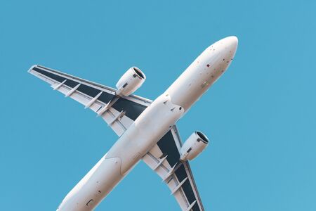 Airplane flies above sky close up view