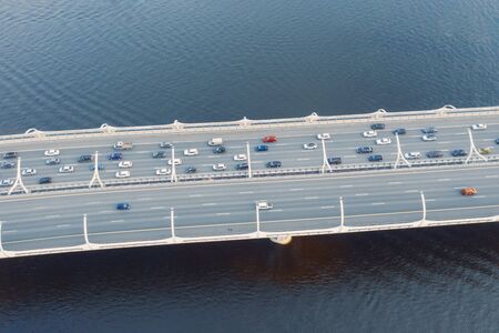 High-speed highway, with multilevel traffic road, the bridge across over the bay sea river. Aerial...