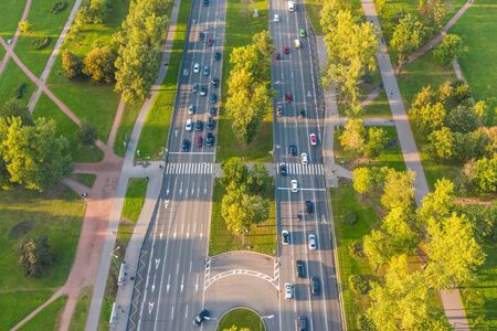 City highway view from above, on the asphalt pavement visible markings for the movement of cars....