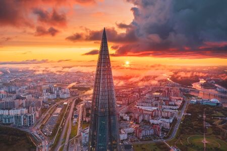 View of the spire of a skyscraper Lakhta Center and a panorama of the urban landscape in the morning at sunrise with clouds and fog. Russia, Saint-Petersburg, 10 september 2019のeditorial素材