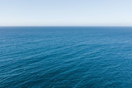 The surface of the sea smooth surface endless horizonの写真素材