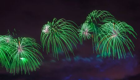 green salute against the background of the night sky wide view