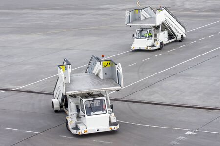 Passenger ladder stairs go one after another at the airportの写真素材