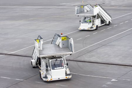 Passenger ladder stairs go one after another at the airportの素材 [FY310142860704]