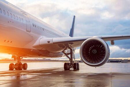 Fuselage of a passenger wide-body airliner, view of the landing gear of the engine and wing in the...