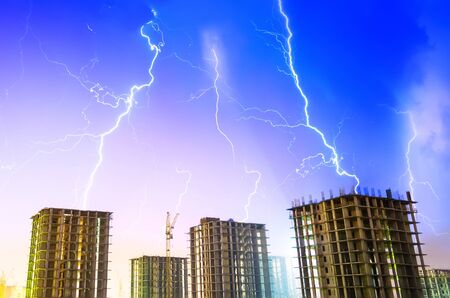 Building night thunderstorm rain industrial city construction.の写真素材