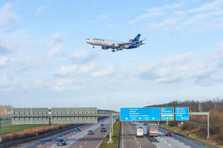 MD-11 Lufthansa cargo airlines. Germany, Frankfurt am main airport, view highway autobahn. 14...
